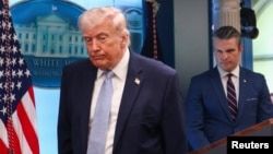 US President Trump attends a press conference with Defense Secretary Pete Hegseth in the briefing room at the White House on April 6.