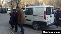 Journalist Khadija İsmayilova entering a courtroom in Baku, Azerbaijan, 5 Dec 2014