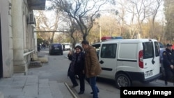 Azerbaijan. Baku. Journalist Khadija İsmayilova entering the court building in Baku