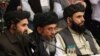 Mullah Abdul Ghani Baradar (center), the Taliban's deputy leader and chief negotiator, attends an international peace conference in Moscow on March 18 with members of a Taliban delegation.