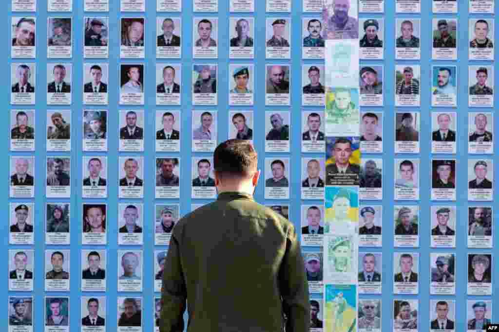 Ukrainian President Volodymyr Zelensky pays his respects after laying flowers at the Memory Wall for fallen soldiers during a ceremony marking Ukraine's Statehood Day in Kyiv on July 15.