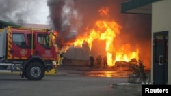 In an image shared by the State Emergency Service of Ukraine, firefighters tackle the blaze following a Russian drone strike in the Volyn region on October 18.