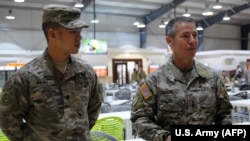 U.S. Army Lieutenant General Scott Miller (right) with one of his soldiers