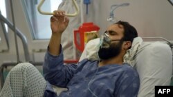 A wounded staff member of Doctors Without Borders, a survivor of the U.S. air strikes on the hospital in Kunduz, receives treatment at a hospital in Kabul on October 6.