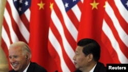 Xi Jinping meets with his U.S. counterpart, Joe Biden, in Beijing in August 2011.