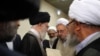 Iran's Supreme Leader Ayatollah Ali Khamenei (center) meets with clerics. "People ask, 'Why are [clerics] silent about [the problems]?' Silence means satisfaction," cleric Abdolhamid Massumi Tehrani, a critic of the establishment, told RFE/RL.