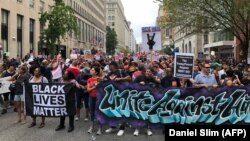 U.S. -- Protestors march against the far-right's Unite the Right rally in Washington, August 12, 2018