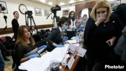 Armenia - Zaruhi Postanjian (L) and two other members of her Yekir Tsirani party stage a protest at a session of Yerevan's municipal council, 13 February 2018.