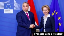 Hungarian Prime Minister Viktor Orban (left) shakes hands with European Commission President Ursula von der Leyen at commission headquarters in Brussels in February 2020.