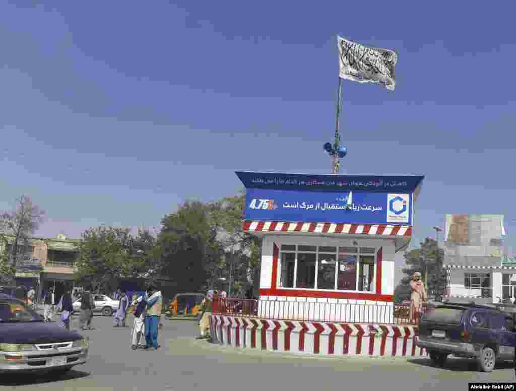 A Taliban flag flies on the main square of the city of Kunduz after fighting between Taliban and Afghan security forces. Government forces in Kunduz appeared to be only in control of the airport and their own base, with all key government buildings in the city in the militants&#39; hands. The main prison in Kunduz was also reportedly under Taliban control. &nbsp;