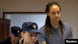 Brittney Griner is escorted after the final statements in a court hearing in Khimki outside Moscow in August.