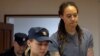 U.S. basketball player Brittney Griner (right) is escorted from a court hearing in Khimki outside Moscow after a trial that saw her sentenced to nine years in a Russian prison.