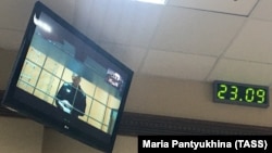 Aleksei Navalny is seen on a screen via video link during a court hearing in Vladimir on September 23.