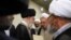 Iran's Supreme Leader Ayatollah Ali Khamenei (center) meets with clerics. "People ask, 'Why are [clerics] silent about [the problems]?' Silence means satisfaction," cleric Abdolhamid Massumi Tehrani, a critic of the establishment, told RFE/RL.