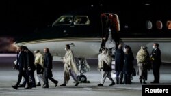 Representatives of the Taliban arrive for talks in Gardermoen, Norway, on January 22.