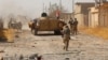 Iraqi Army units and Shi'ite militia gather in their battle against Islamic State militants outside Tal Afar on August 24.