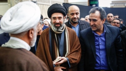 Khamenei with his son Mojtaba or a general family
