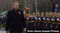 Romanian President Klaus Iohannis attends a military parade in Bucharest in December. 