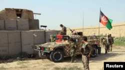 FILE: Afghan forces in the northern Kunduz province