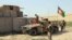 FILE: Afghan forces in the northern Kunduz province