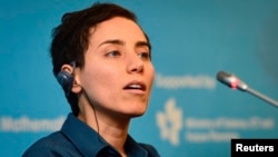 Iranian mathematician Maryam Mirzakhani speaks at an awards ceremony for mathematicians in Seoul in 2014.