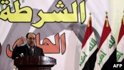 Iraqi Prime Minister Nuri al-Maliki gives a speech to a police unit in Baghdad on January 9.