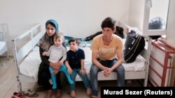 یکی از خانواده های مهاجر افغان در ترکیه