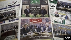 Иранские газеты, на первых полосах которых опубликованы материалы о состоявшемся разговоре президента США Барака Обамы с президентом Ирана Хасаном Роухани. Тегеран, 28 сентября 2013 года.