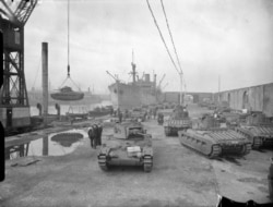 British Matilda tanks are loaded onto a ship for transportation to the U.S.S.R. as part of the Lend-Lease program.