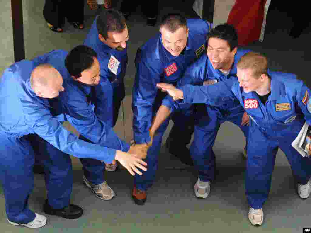 For others, the journey was about to begin. Six scientists from Europe, Russia, and China were locked away from the outside world on June 3 in Moscow for the Mars-500 mission, an unprecedented experiment to simulate the effects of a mission to Mars over the next year and a half. Photo by Alexander Nemenov for AFP