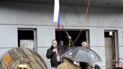 Protest Leader Brandishes AK-47 At Pro-Russian Rally In Luhansk (Clean)