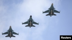 Russia -- Russian military jets flying from Syria are seen shortly before landing on the runway of an airbase in Buturlinovka in Voronezh region