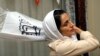 IRAN -- Former imprisoned Iranian lawyer and human rights activist Nasrin Sotoudeh adjusts her scarf at her house in Tehran, September 18, 2013