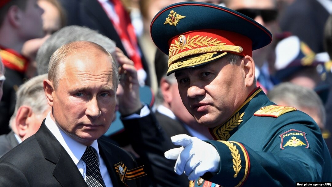 Russian President Vladimir Putin (left) and Defense Minister Sergei Shoigu attend a Moscow parade marking victory in World War II in June 2020.