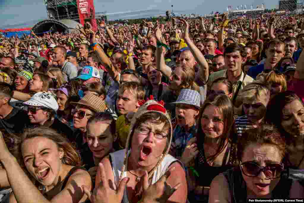 Music fans dance in front of the main stage.