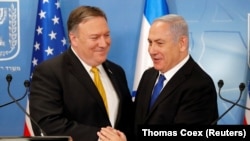 U.S. Secretary of State Mike Pompeo speaks with Israeli Prime Minister Benjamin Netanyahu in Tel Aviv on April 29.