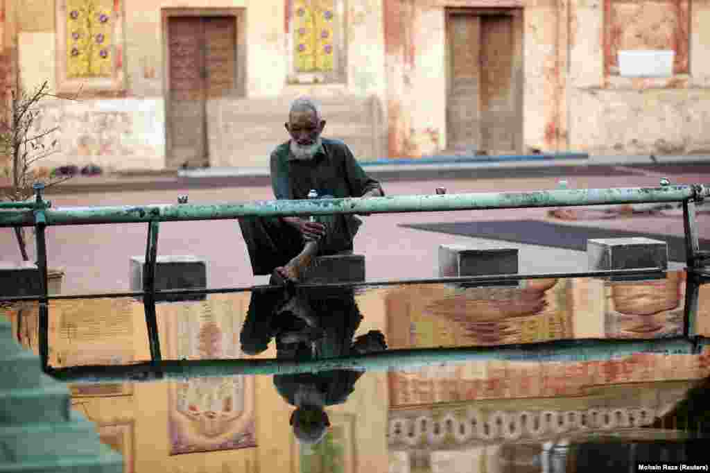 A Pakistani man washes his feet at a mosque during the fasting month of Ramadan in Lahore. (Reuters/Mohsin Raza)