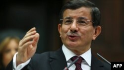 Turkey -- Turkish Prime Minister Ahmet Davutoglu addresses members during the parliamentary group meeting of Turkey's ruling Justice and Development Party in Ankara, on March 17, 2015