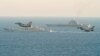 Royal Air Force Typhoons monitor Russian warships the Pyotr Veliky and the Admiral Kuznetsov (rear) as they pass near England on January 25.