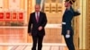 Russian President Vladimir Putin walks past an honor guard as he attends a ceremony at the Kremlin in Moscow.