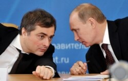 Russian President Vladimir Putin (right) appointed Vladislav Surkov as an aide in 2013. (file photo)