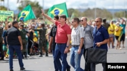 Президент Бразилии Жаир Болсонару в дни эпидемии