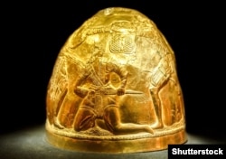 A gold helmet from the fourth century B.C. that was discovered on the Crimean Peninsula and is currently held by Ukraine.