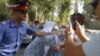 Mother Of Tajik Attack Suspect Pours Gasoline On Herself In Protest