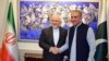 Pakistani Foreign Minister Shah Mehmood Qureshi (R) shakes hands with his Iranian counterpart Mohammad Javad Zarif at the Foreign Ministry in Islamabad on May 24.