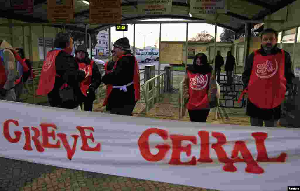 Workers picket at the entrance to the Mitrena shipyard in Lisbon, Portugal.