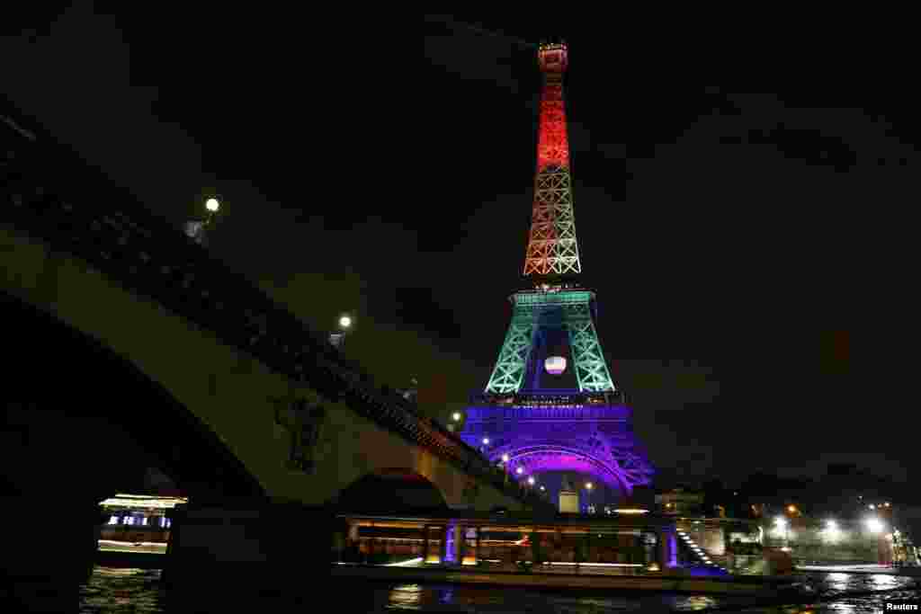 The Eiffel Tower in Paris is illuminated in the colors of the rainbow gay-pride flag in memory of the 49 victims of the massacre at a gay nightclub in Orlando. (Reuters/Gonzalo Fuentes)