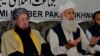 Taliban negotiators Sami-ul Haq (L) and Ibrahim Khan.