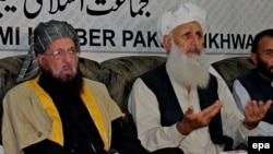 Taliban negotiators Sami-ul Haq (L) and Ibrahim Khan.
