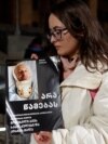 Georgian Activist Decorates Tbilisi Christmas Tree With Images Of People Beaten At Protests Georgian Activist Decorates Tbilisi Christmas Tree With Images Of People Beaten At Protests